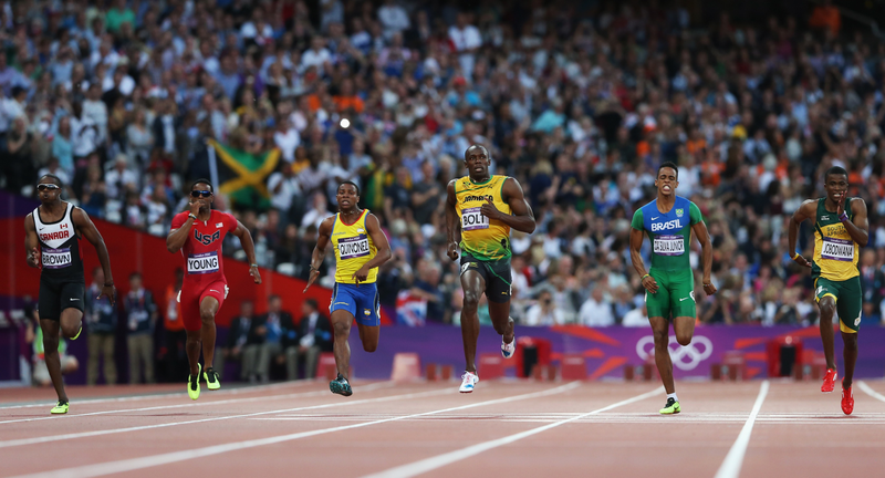 Illustration for article titled Photos Of Usain Bolt Looking Bored As He Blows Past The Best Runners In The World
